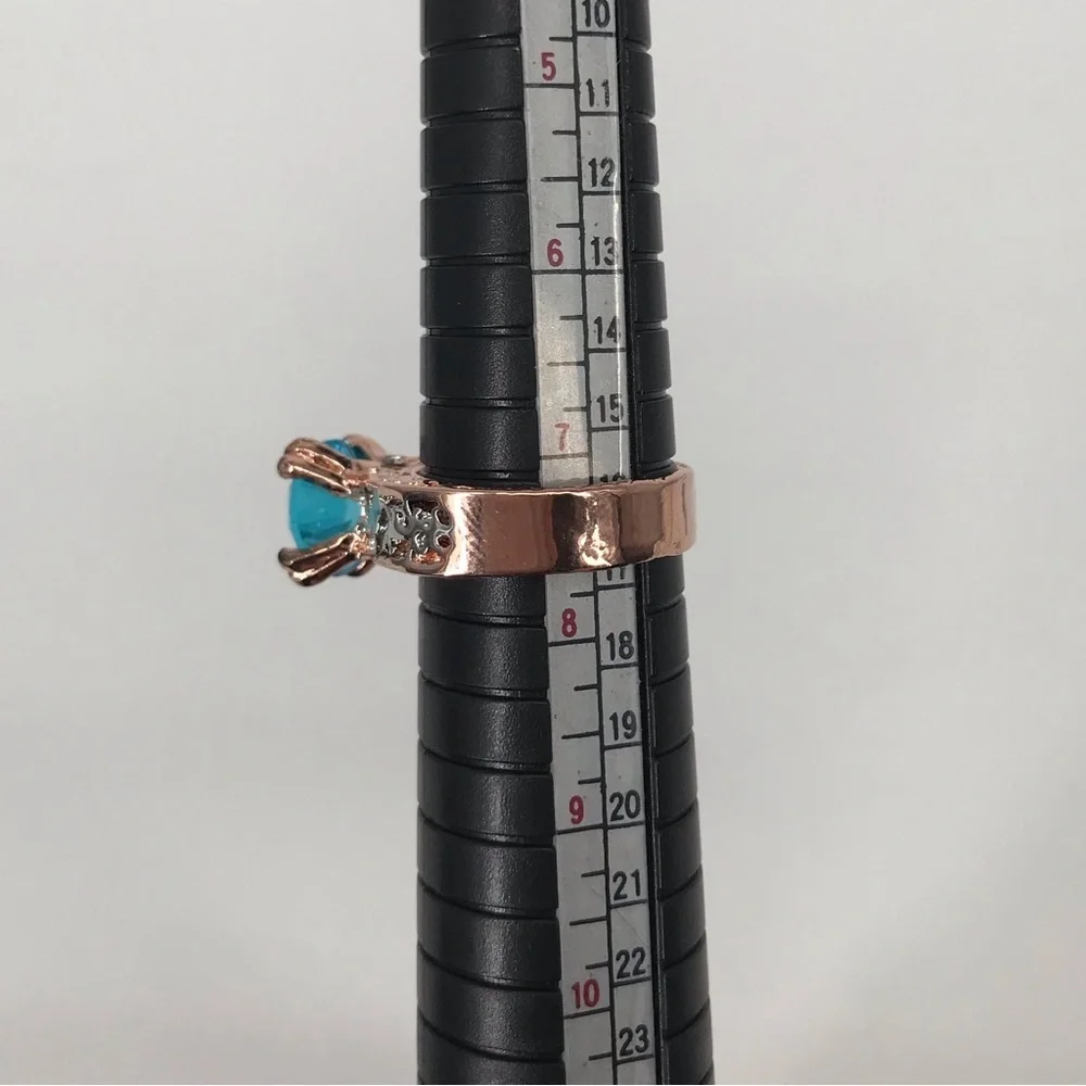 Mixed Metal Solitaire Ring with Blue Stone